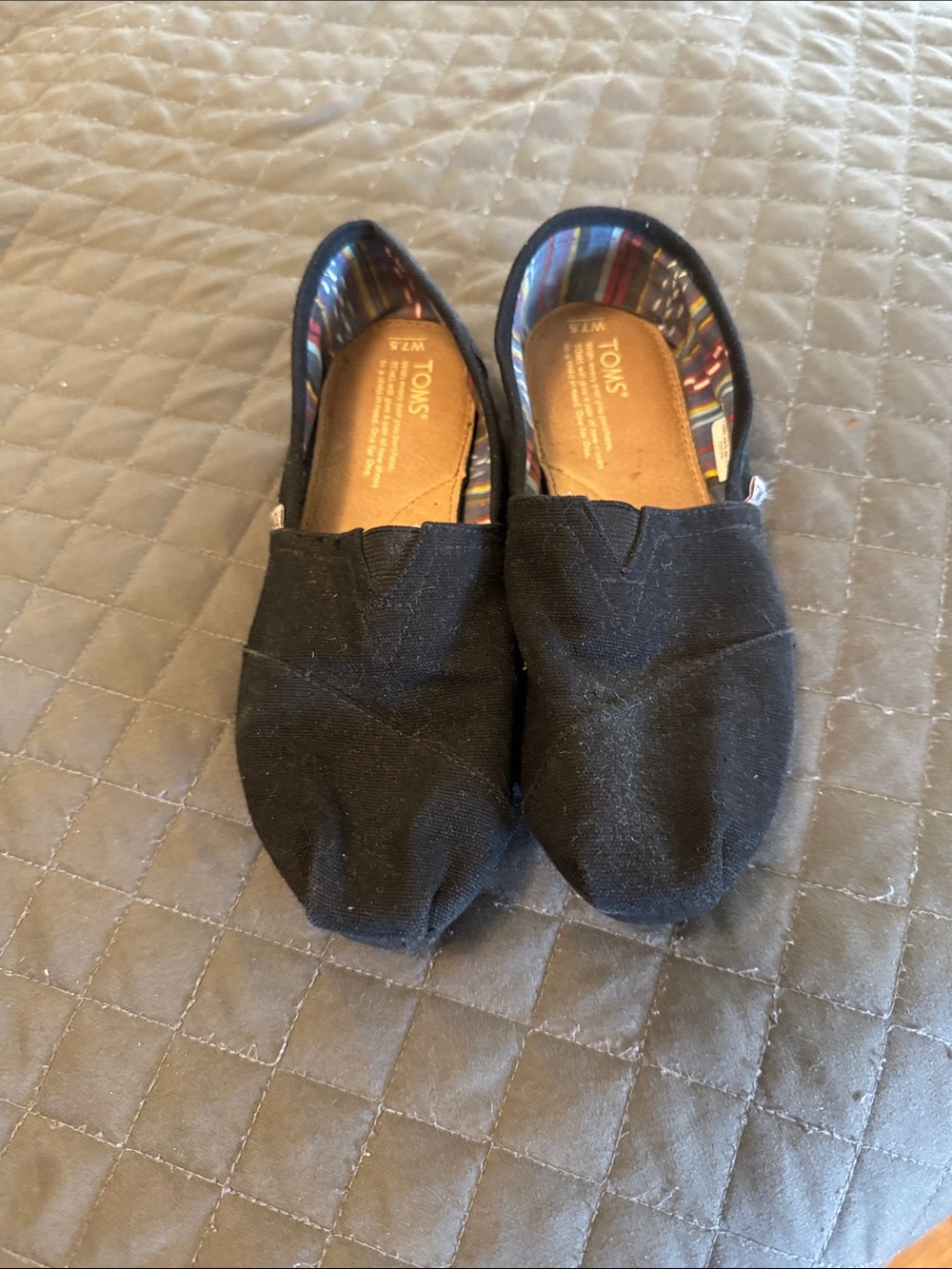 TOMS women’s Black Canvas Slip-On Moccasins